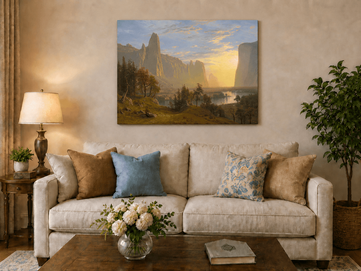 Unframed hand-painted Yosemite Valley oil painting with towering cliffs in golden light displayed above a neutral living room sofa.