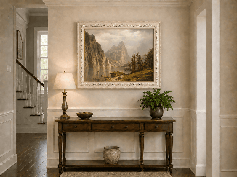 Framed hand-painted Yosemite Valley oil painting with the Merced River and mountain cliffs displayed above an entryway console table.