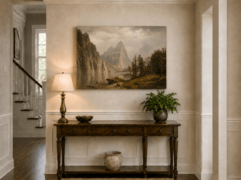 Unframed hand-painted Yosemite Valley oil painting with the Merced River and mountain cliffs displayed above an entryway console table.