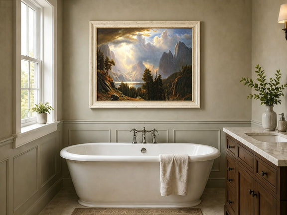 Framed hand-painted Yosemite Valley oil painting with storm clouds and dramatic sunbeams displayed above a freestanding bathtub.