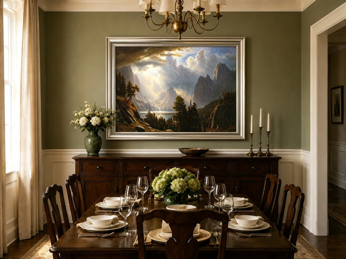 Framed hand-painted Yosemite Valley oil painting with storm clouds and dramatic sunbeams displayed above a formal dining table.