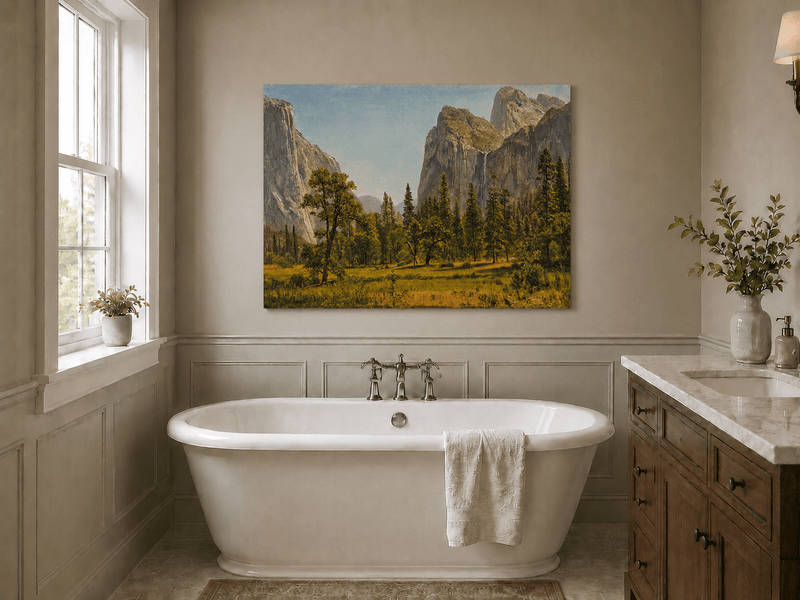 Unframed hand-painted Yosemite Valley oil painting with a waterfall and towering granite cliffs displayed above a freestanding bathtub.