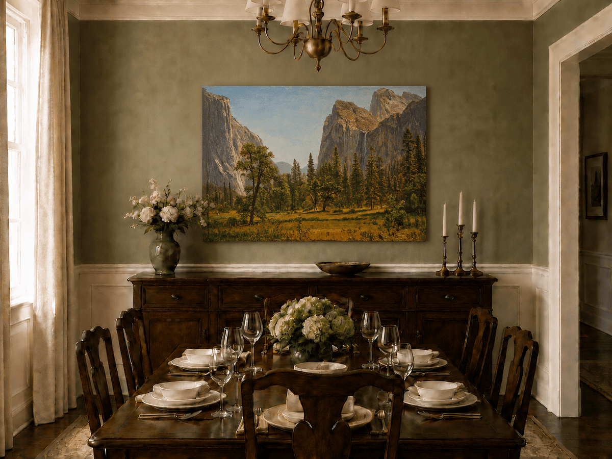 Unframed hand-painted Yosemite Valley oil painting with a waterfall and towering granite cliffs displayed above a formal dining table.