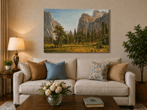 Unframed hand-painted Yosemite Valley oil painting with a waterfall and towering granite cliffs displayed above a neutral living room sofa.